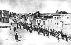 Armenians are marched to a nearby prison in Mezireh by armed Turkish soldiers. Kharpert, Armenia, Ottoman Empire, April, 1915